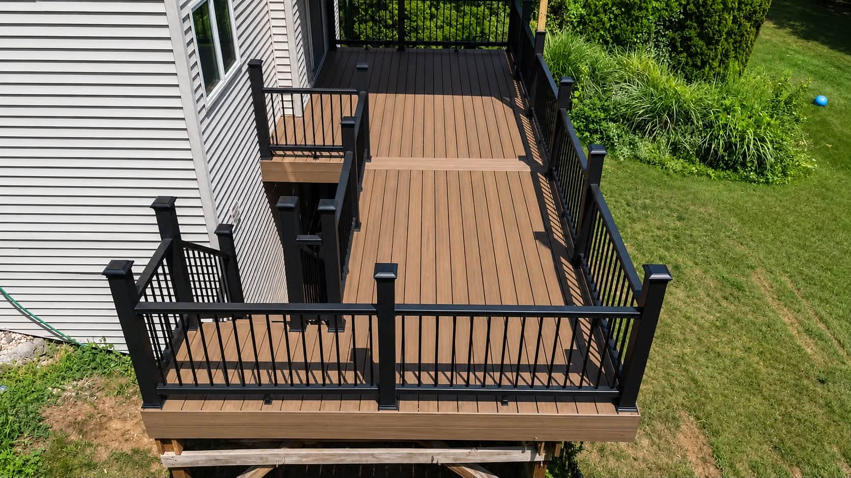 Composite deck build with black aluminum railing
